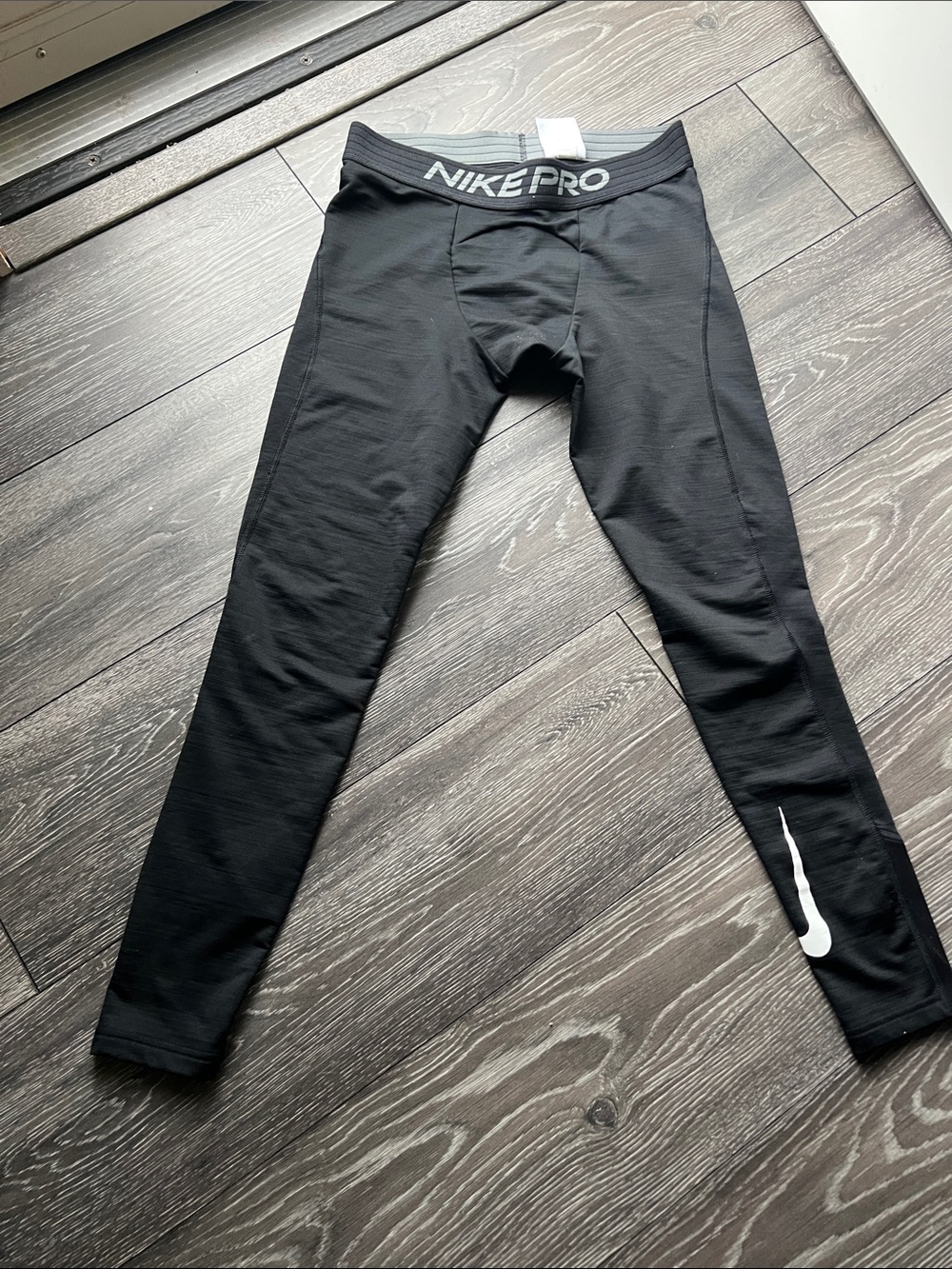 Nike Black Youth Compression Leggings with White Swoosh